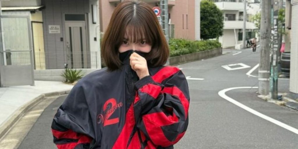 aespa Karina wearing a controversial red jersey seemingly supporting People Power party
