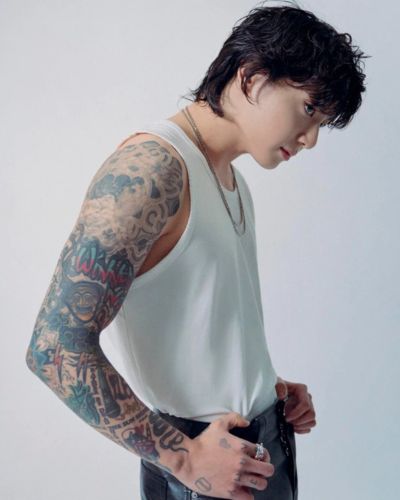 Jungkook tattoo arm being displayed in a teaser for single "Seven"