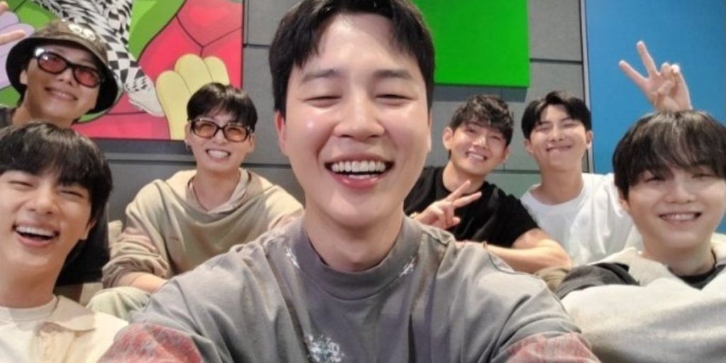 BTS members smiling and chatting during their first OT& weverse live after military hiatus